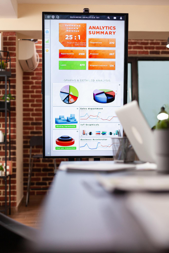 monitor-with-management-graph-it-standing-empty-startup-company-office-during-business-meeting-ready-financial-work-workplace-with-modern-furniture-concept-corporation-job (1)